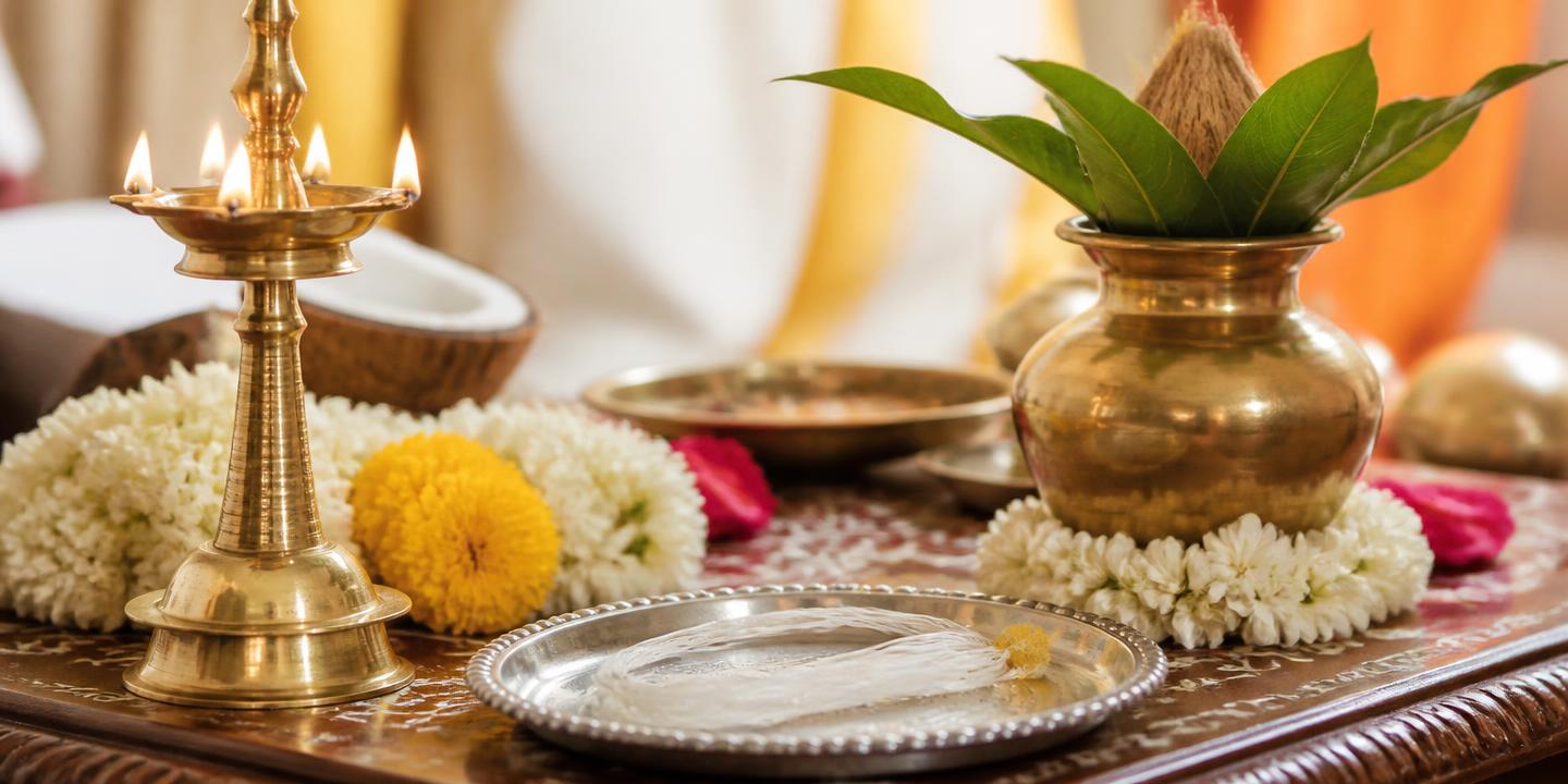 Brass lamp, kalash and sacred thread arranged for a Vedic samskara rite